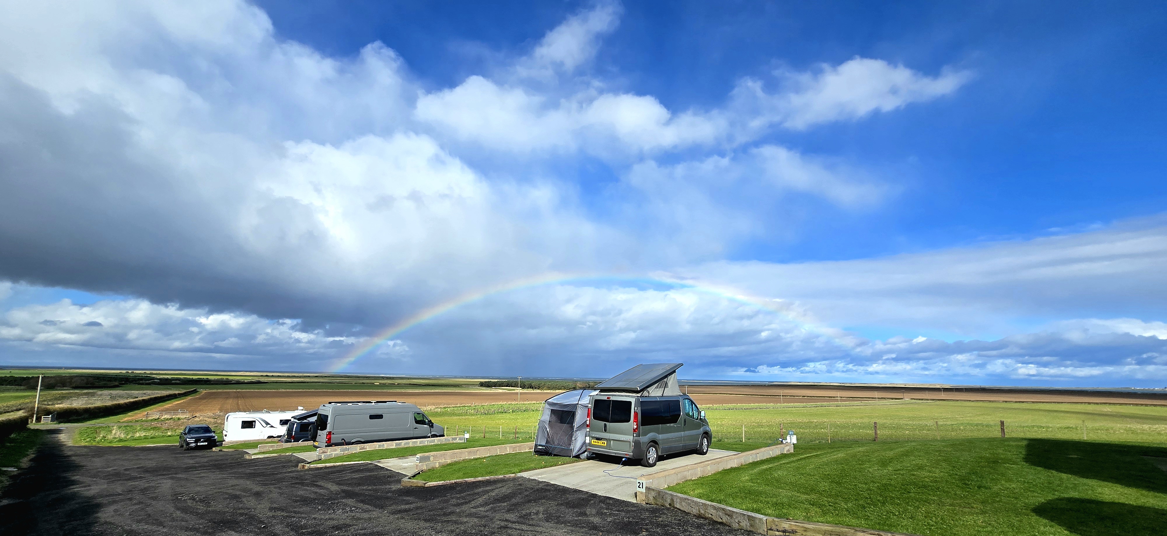 H21 rainbow picture with Goswick beach and Holy Island on the background